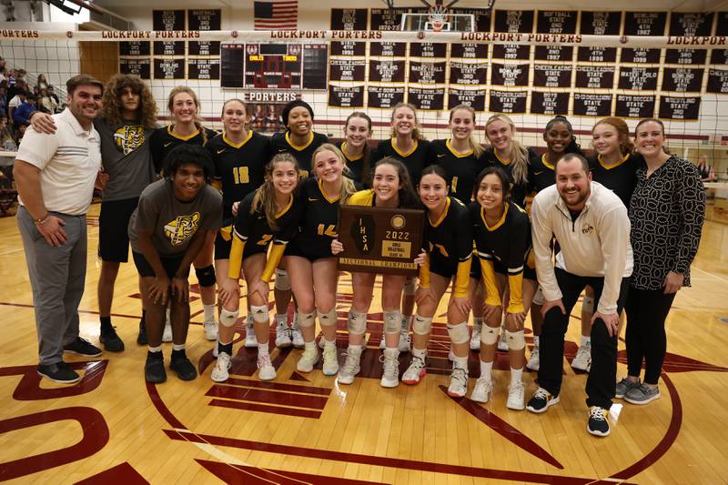 Joliet West poses with the championship plaque after a two set win over Sandburg in the in the Class 4A Lockport Sectional title match on Wednesday.