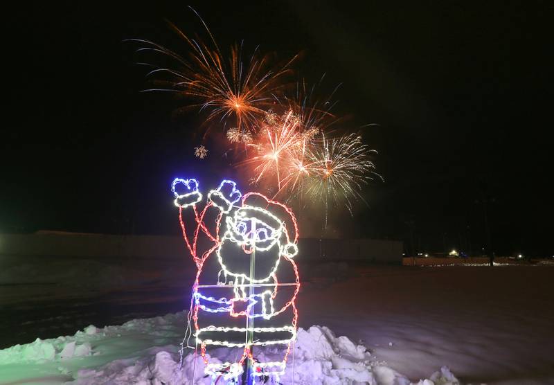 Fireworks fill the sky above Santa Claus during the Christmas Fireworks Spectacular on Saturday, Dec. 6, 2025 at the Bureau County Fair in Princeton.