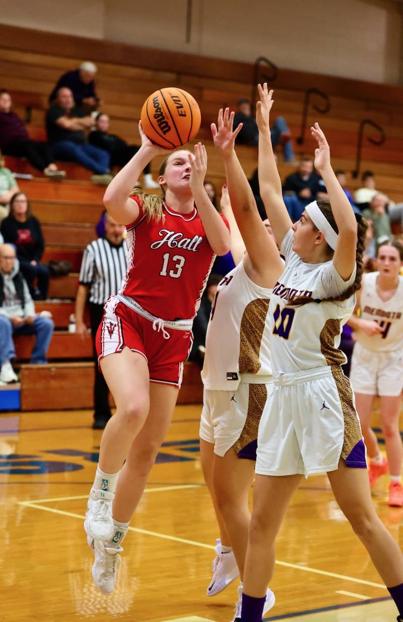 Hall's Caroline Morris shoots over Mendota's Brooklyn Maxa in Thursday's game at Prouty Gym. The Red Devils won 48-22 to improve to 2-0.
