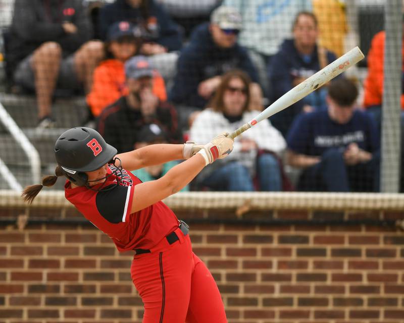 Benet Academy's Sophia Rosner (21) makes contact with the ball for a base hit on Friday May 22, 2026, during the regional final game held at Oswego High School.