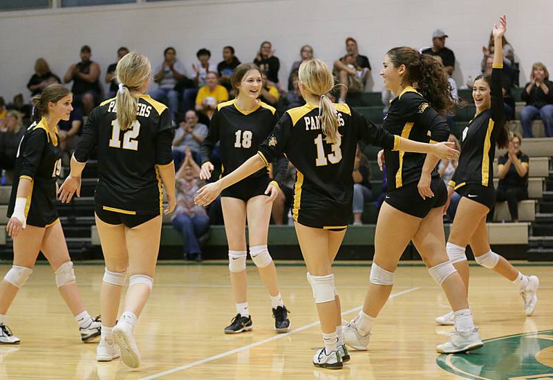 Members of the Putnam County volleyball team smile after defeating Earlville in the Class 1A Regional game on Monday, Oct. 24, 2022 at St. Bede Academy in Peru.