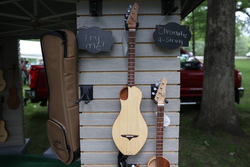 Vendors set up tents to instruments and accessories at the Gebhard Woods Dulcimer & Traditional Music Festival on Saturday June 8, 2024 in Morris.