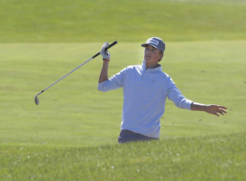 Libertyville’s Wyatt Sorensen watches his fairway shot out of the sand trap on the seventh hole during the IHSA Boys’ Class 3A Sectional Golf Tournament Monday, Oct. 3 2022, at Randall Oaks Golf Club in West Dundee.