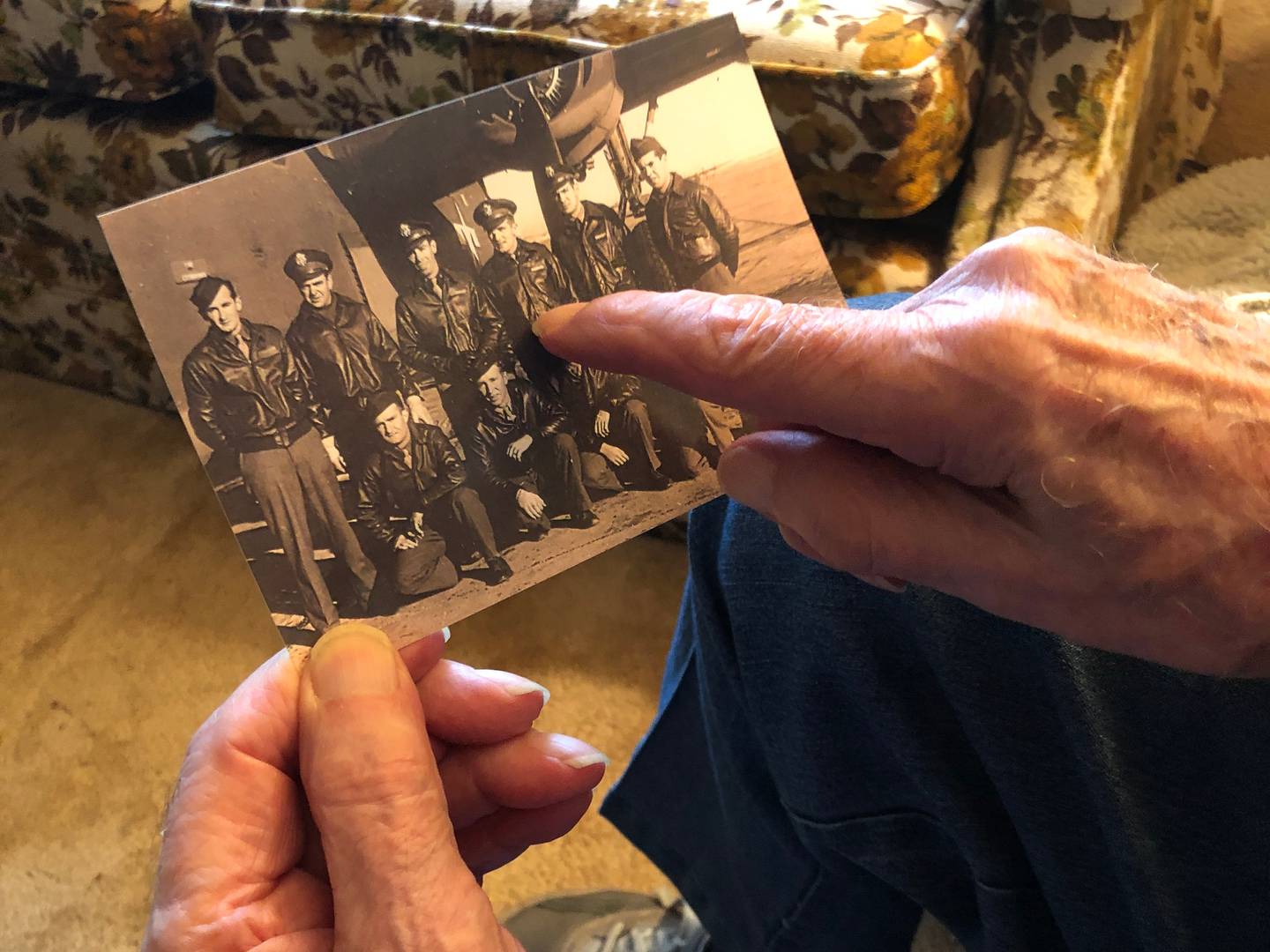 Edward “Bud” Berthond, who turns 103 later this month, points himself out on a photo from the day he received his pilot wings 79 years ago. Sen. Tammy Duckworth stopped in to wish him a happy birthday on Friday, Nov. 4, 2022.