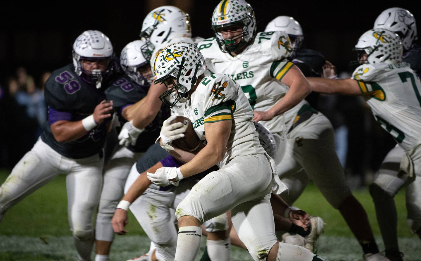 Coal City's Logan Natyshok carries the ball on a play in a game against Wilmington on Friday, October 24, 2025.