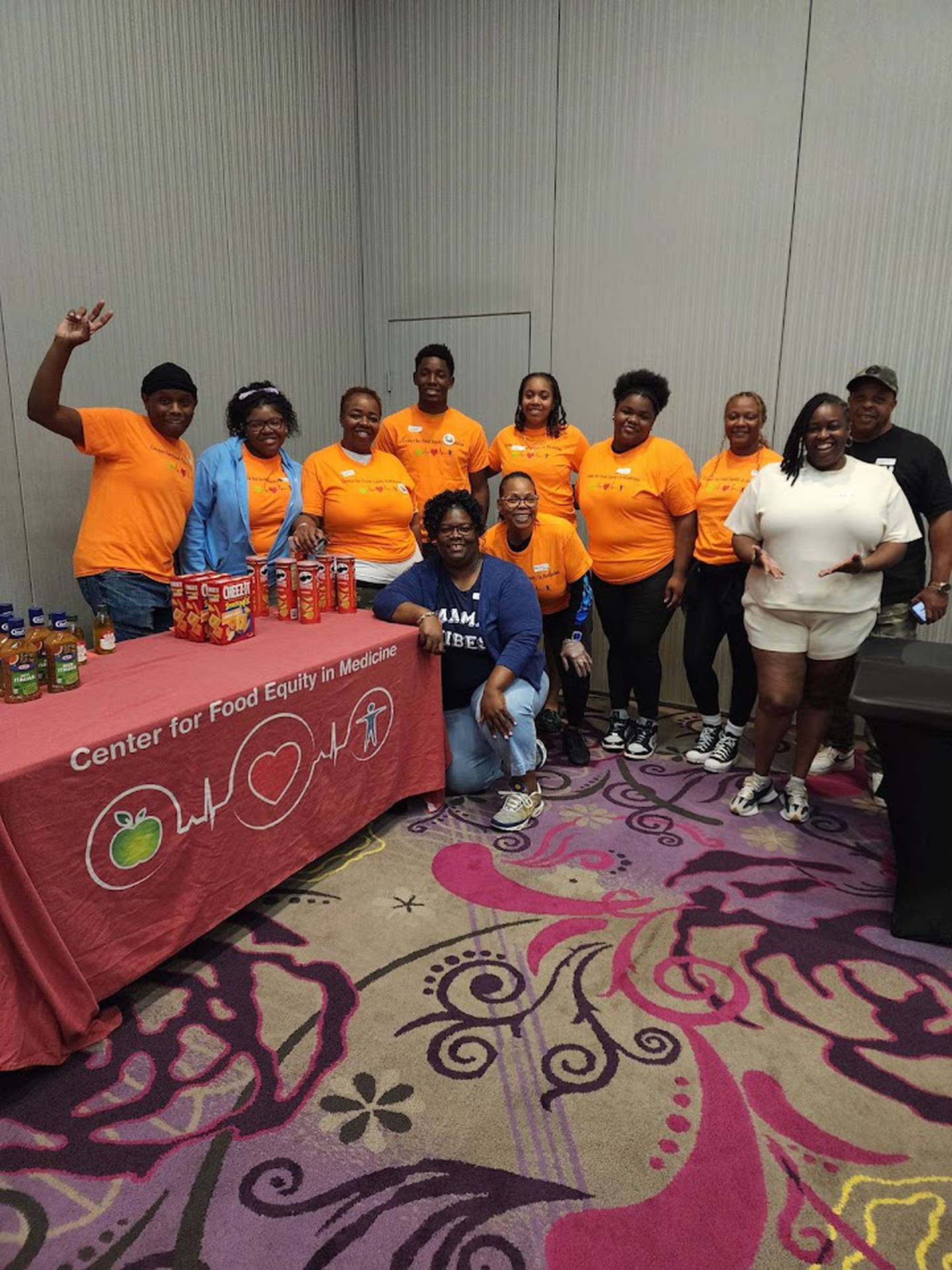 Volunteers work at a pop-up Complimentary Nutrition Station for the community, hosted by the Center for Food Equity in Medicine. The center's founder, Ann Jackson, inspired Joliet social worker Paul Dickerson to found his own nonprofit to help provide healthy food to cancer patients in Will County.