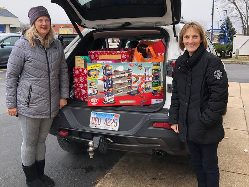 Grundy County Heroes and Helpers accepts the donation of toys from Procter & Gamble.