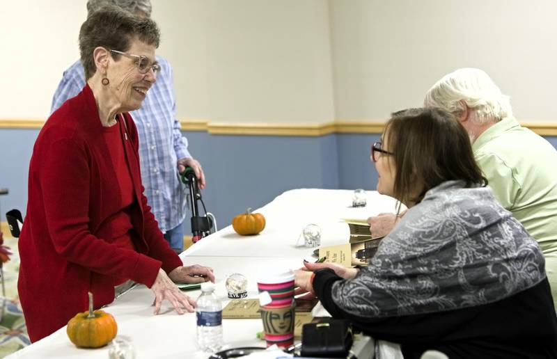 Timbers of Shorewood resident Dorthy Brumbaugh talks to Author Holly Coop during the WriteOn Joliet visit at the Timbers of Shorewood during an event called “Meet the Authors” Thursday, November 9, 2023 Shorewood Ill.