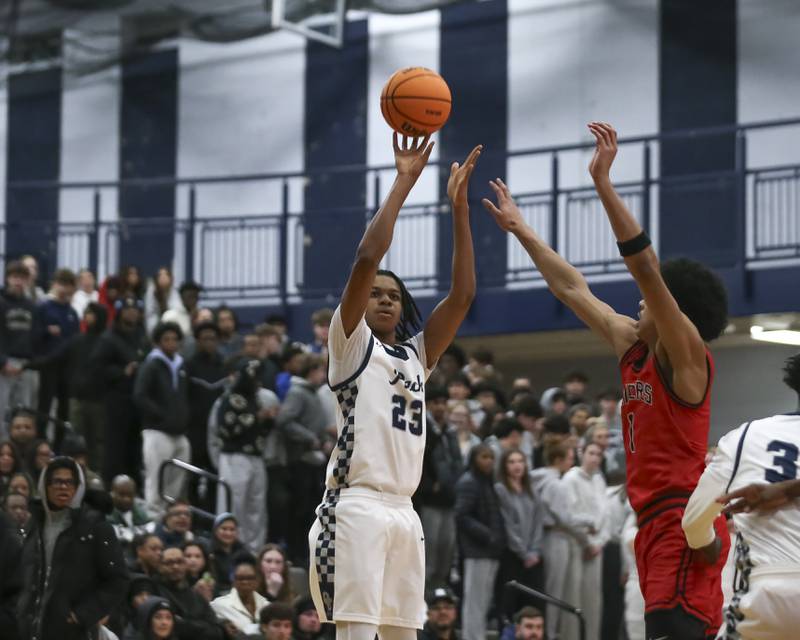 Oswego East's Mason Lockett (23) shoots a jump shot during their basketball game between Bolingbrook at Oswego East Friday, Jan 30, 2026 in Oswego.
