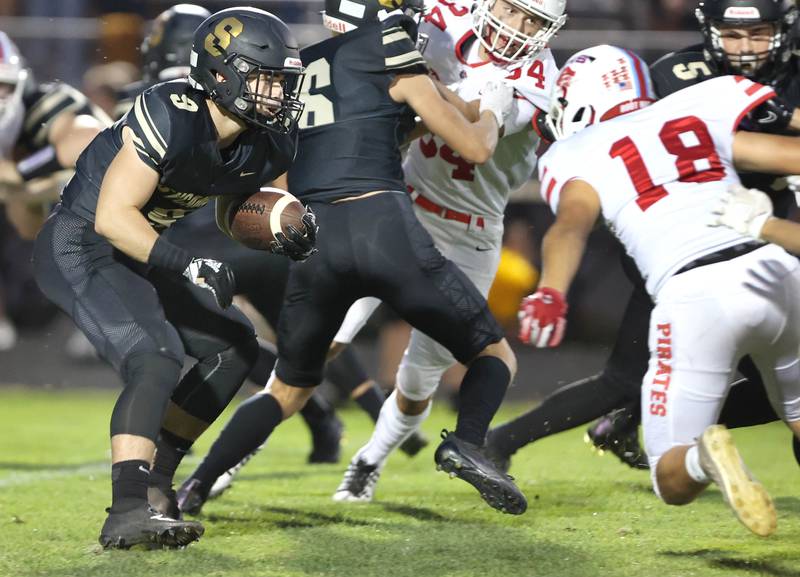 Sycamore's Dawson Alexander tries to get by Ottawa's Luke Boaz during their game Friday, Sept. 16, 2022, at Sycamore High School.