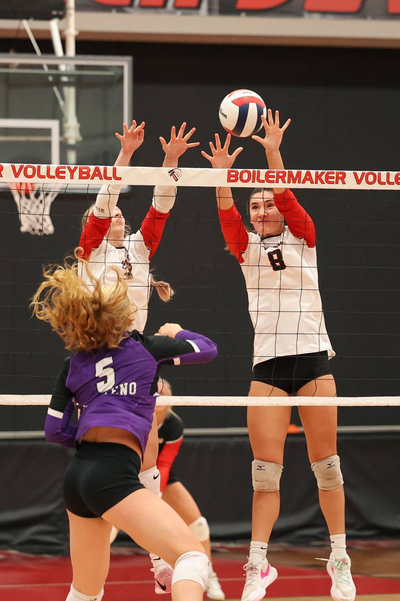 Bradley-Bourbonnais' Hannah Wojnowski, right, and Samantha Harsy jumps to block a hit by Manteno's Kendall Blanchette during the Panthers' victory in three sets, 25-21, 23-25, 25-17, over the Boilermakers on Monday, Sept. 15, 2025.