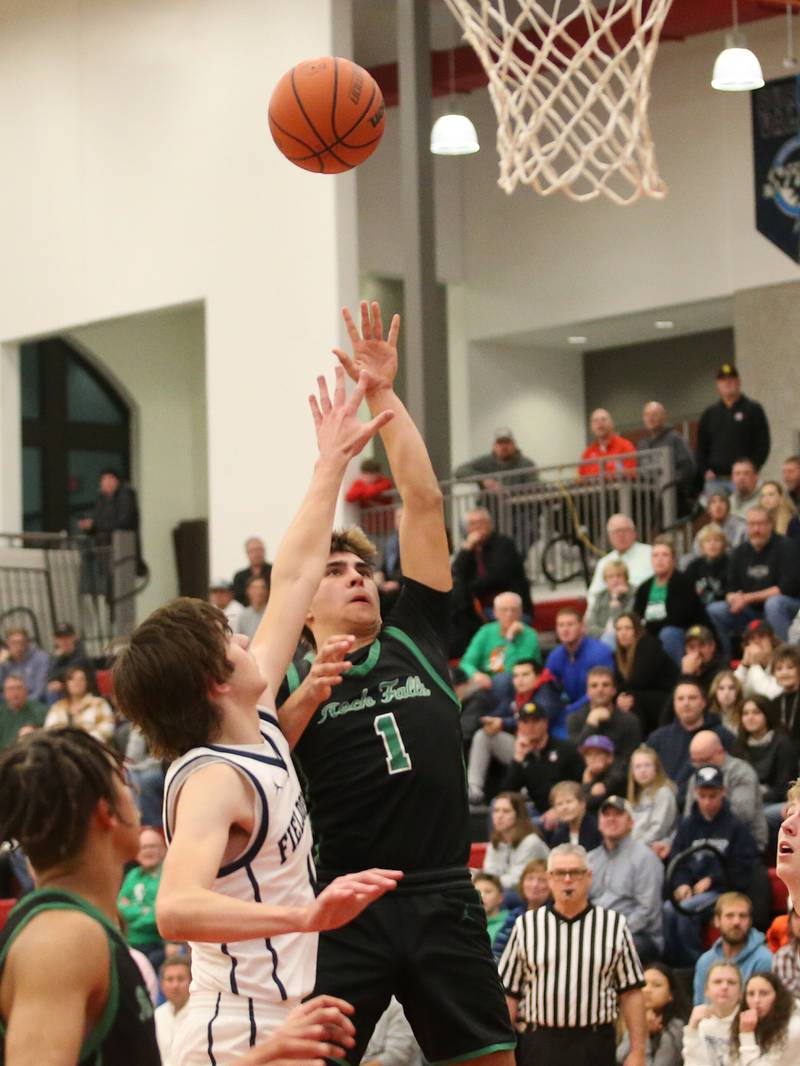 Rock Falls's Austin Castaneda shoots a shot over Fieldcrest's Brady Ruestman during the 49th annual Colmone Classic on Saturday, Dec. 9, 2023 at Hall High School.