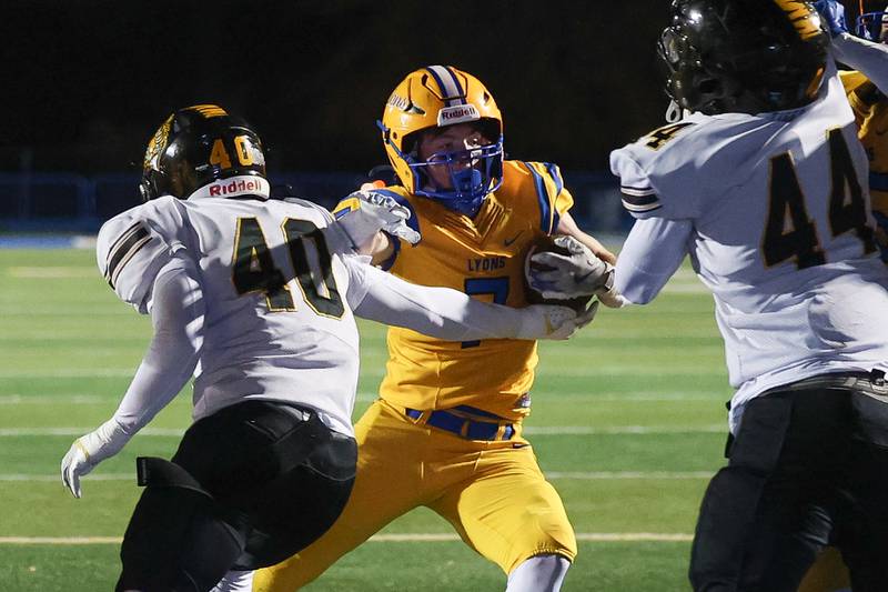 Lyons Township’s Danny Carroll weaves his way in for his third touchdown in the first half against Joliet West in the first round of the playoffs on Friday, Nov. 1, 2024 in La Grange.