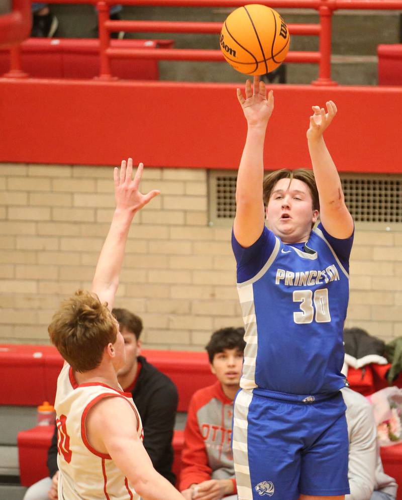 Princeton's Jordan Reinhardt shoots a jump shot over Ottawa's Evan Snook on Monday, Feb. 3, 2025 in Kingman Gymnasium at Ottawa High School.