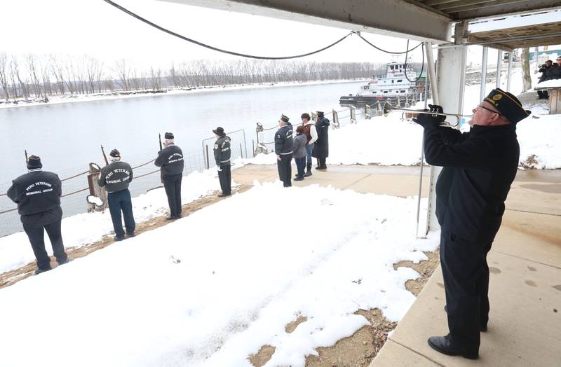 Ottawa American Legion Post 33 trumpeter Gary Wood offers his rendition of "Taps" during the 46th annual Peal Harbor parade and Memorial service at the South Shore Boat Club in Peru.