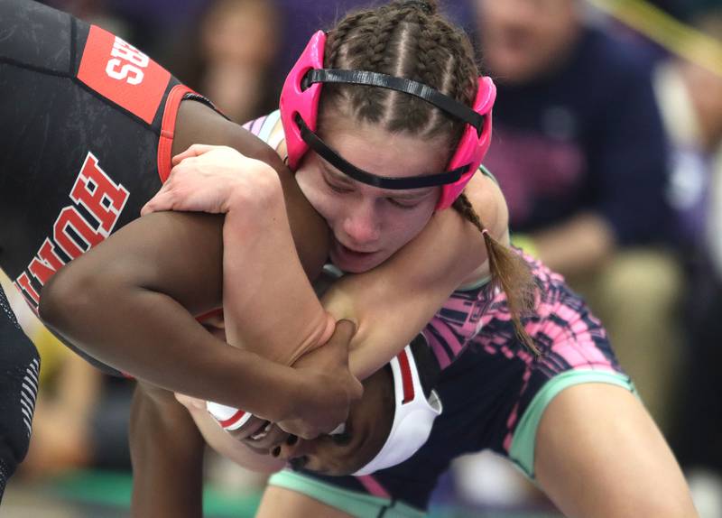 Huntley’s Janiah Slaughter, bottom, battles Woodstock’s Eva Hermansson at 100 pounds in varsity girls IHSA Regional Championship wrestling action on Saturday, February 7, 2026, at Hampshire High School in Hampshire.