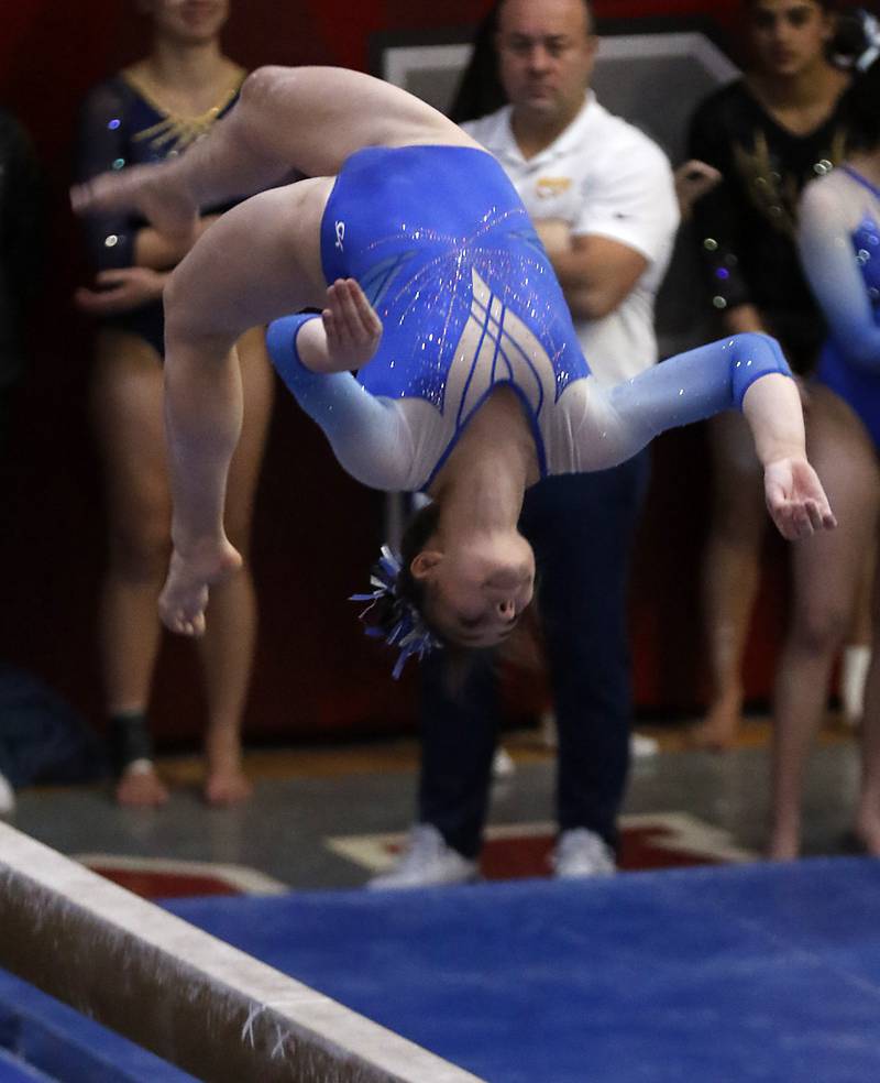 Vernon Hills' Livy Tran competes in the preliminary round of the balance beam Friday, Feb. 17, 2023, during the IHSA Girls State Final Gymnastics Meet at Palatine High School.