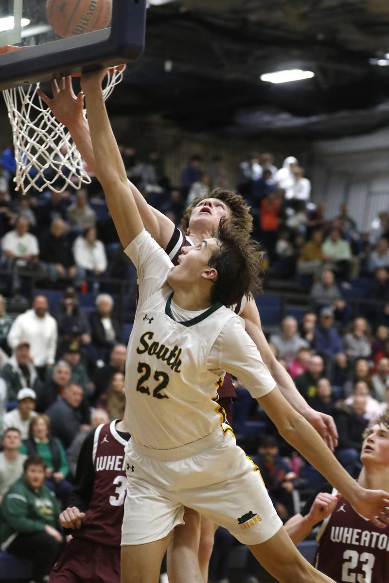 Crystal Lake South's Tony Santarelli drives to the basket against Wheaton Academy's Tyler Smith during the IHSA Class 3A Cary-Grove Boys Basketball Regional Championship game on Friday, Feb. 23, 2024 at Cary-Grove High School.