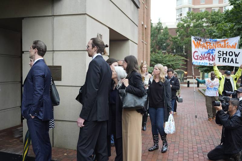 Family of former FBI Director James Comey and others, arrive at federal court in Alexandria, Va., Wednesday, Oct. 8, 2025. (AP Photo/Alex Brandon)