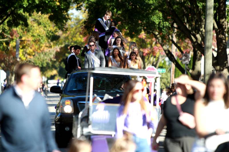 Members of the Downers Grove North Homecoming Court ride on a float on Friday, Oct. 18, 2024 during the school’s annual homecoming parade.