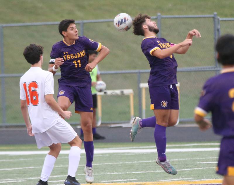 Mendota's Cameron Kelly and teammate Izaiah Nanez jump in the air for a header over Winnebago's Eli Intravaia on Wednesday, Oct. 4, 2023 at Mendota High School.