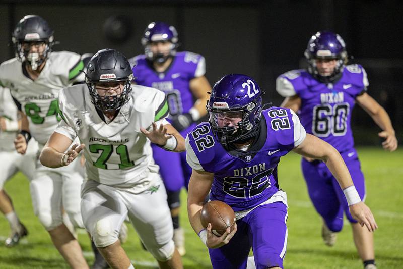 Dixon’s Aiden Wiseman looks for running room in the first quarter Friday, Oct. 21, 2022 against Rock Falls.