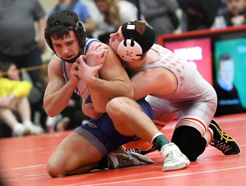 Princeton's Augie Christiansen (left) wrestles Woodstock Marian's Fitzgerald in a 145-pound consolation semifinal at the 1A Oregon Wrestling Sectional on Saturday. Christiansen finished fourth in the event to qualify for next week's state finals
