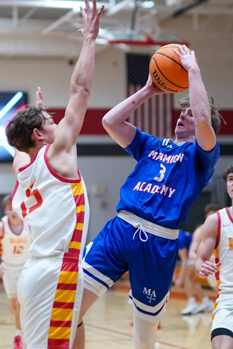 Marmion's Mac Moore (3) shoots the ball over Batavia’s Dane Farrar (15) during a basketball game at Batavia High School on Wednesday, Nov. 27, 2024.