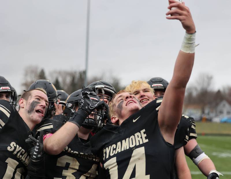 Sycamore players take a selfie after their win over Sterling in the Class 5A state playoff game Saturday, Nov. 12, 2022, at Sycamore High School.