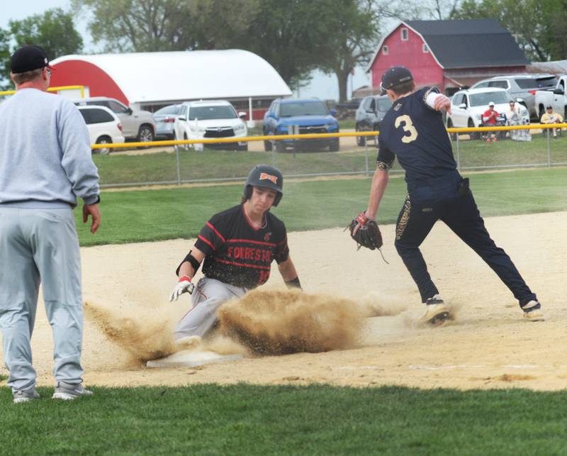 Forreston's Carson Akins slides safely into third ahead of the throw to Polo's Nolan Hahn during a Thursday, May 2, 2024 game at Forreston High School.