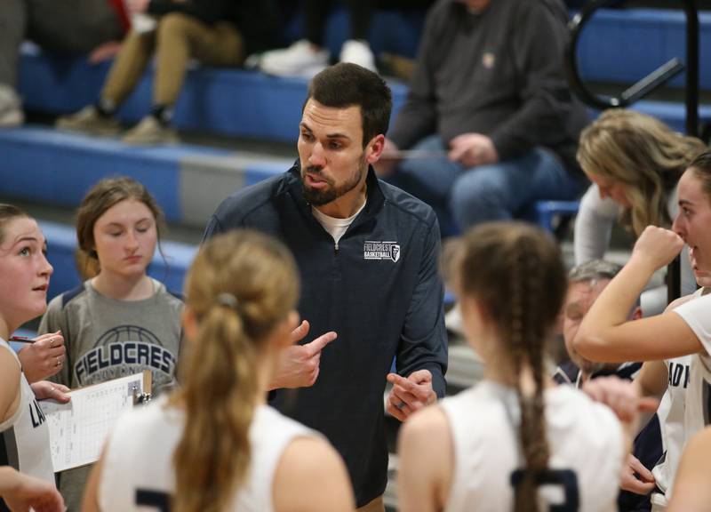 Fieldcrest girls basketball head coach Mitch Neally talks to his team during a timeout against Eureka on Monday, Jan. 9, 2023 at Fieldcrest High School.