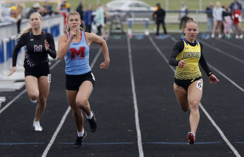 Marengo’s Ava Frederick, Marian Central’s Addie Leitzen and Johnsburg’s Hope Klosowicz race to finish line in the 100 meter dash during the IHSA Class 2A Johnsburg Girls Track and Field Sectional Meet on Wednesday, May 13, 2026, at Johnsburg High School.