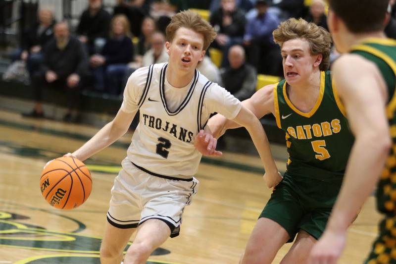 Crystal Lake South’s Carson Trivellini, right, guards Cary-Grove’s AJ Berndt  in boys IHSA Class 3A Regional Championship basketball on Friday, Feb. 27, 2026, at Crystal Lake South High School in Crystal Lake.