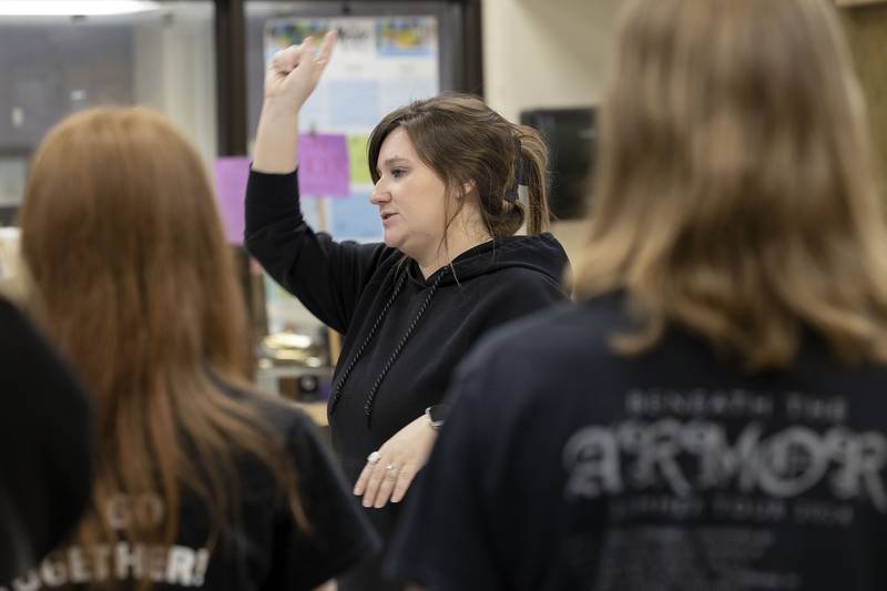 Erin Rogers leads her choir at Dixon High School Thursday, April 10, 2025.