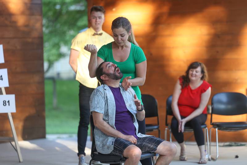 Miriam Naponelli and Sam Barbaro do a dentist office improv hosted by the Morris Library at Goold Park on Friday, Aug. 11, 2023 in Morris.