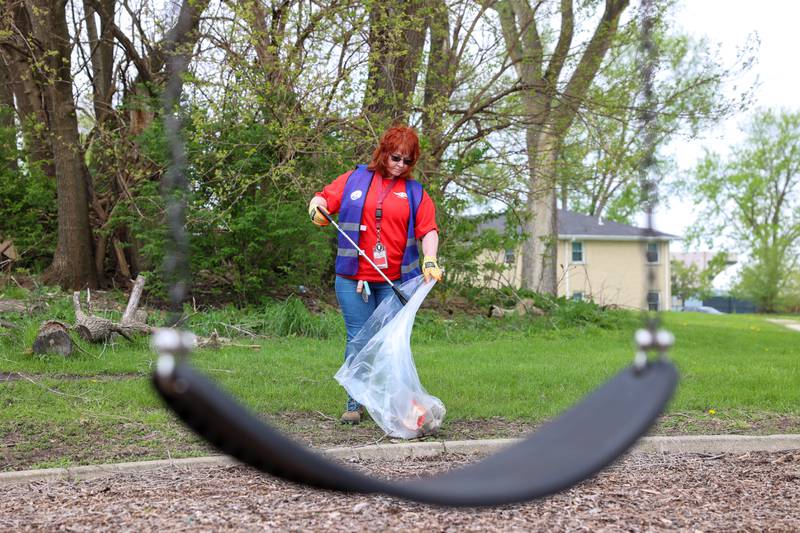 Volunteer Lisa Hassett, with Dow Chemical in Kankakee, cleans up Washington Park during the United Way of Kankakee & Iroquois Counties’ annual Day of Action on Wednesday, April 22, 2026.
