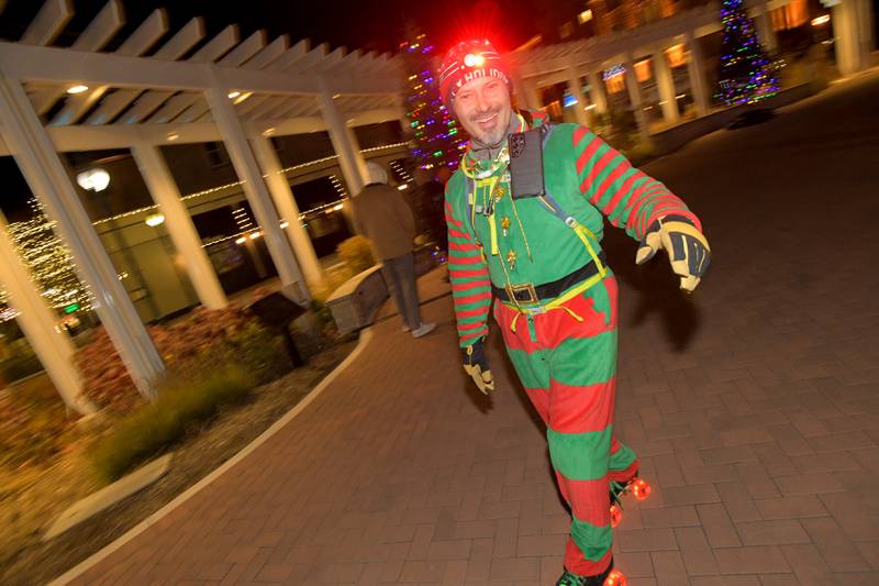 Tony Encarnacion of St. Charles skates through 1st Street Plaza dressed as an Elf during the Lighting of the Lights Ceremony on Friday, Nov 28, 2025 in St. Charles.