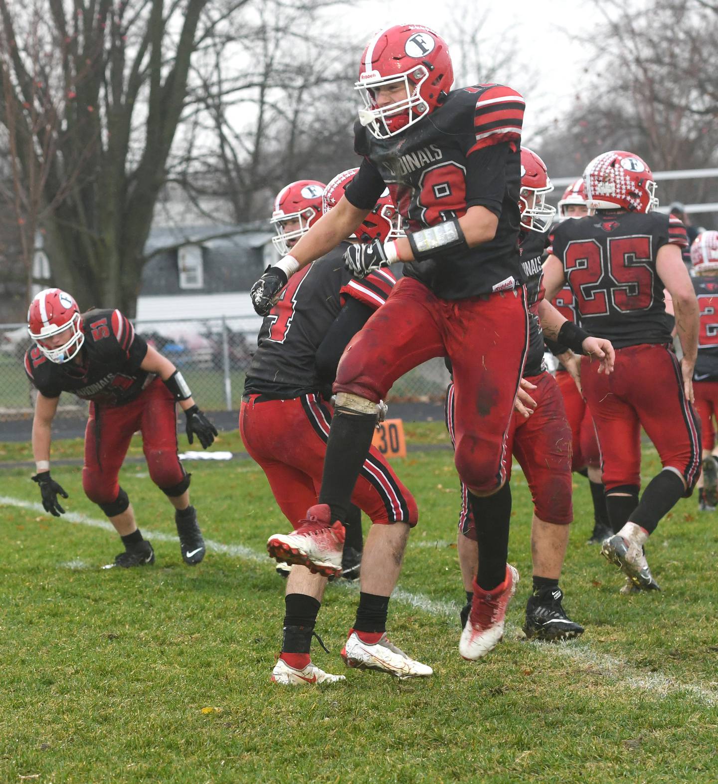 Forreston's Alex Milnes celebrates with his teammates after their 44-16 playoff win over Chicago Hope Acaademy on Saturday, Nov. 5.