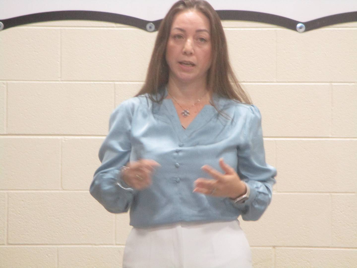 Joliet resident Alma Montero speaks to people who attended a community meeting Wedesya on future use of the former Joliet Correctional Center property. Oct. 22, 2025