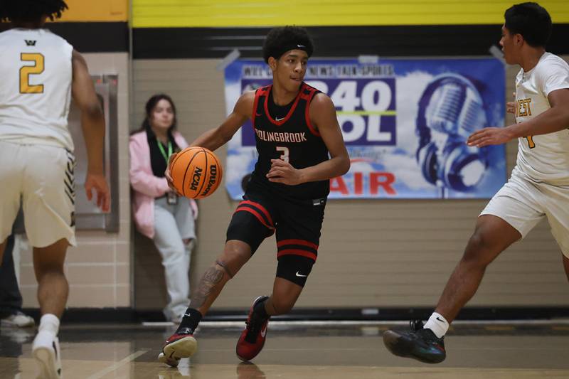 Bolingbrook’s Davion Thompson works the ball upcourt against Joliet West on Friday, Jan 24, 2025 in Joliet.