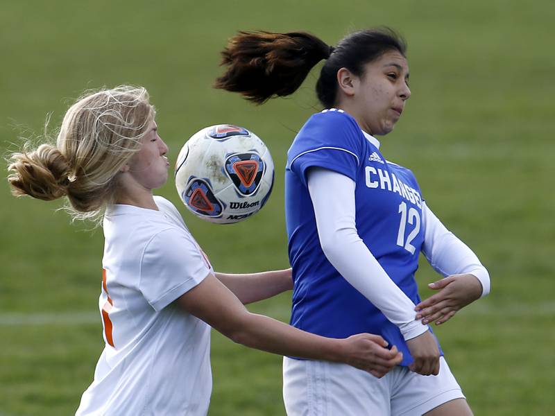 Crystal Lake Central's Olivia Anderson tries to control the ball as it falls between her and Dundee-Crown's Alejandra Melo during a Fox Valley Conference soccer match Tuesday April 26, 2022, between Crystal Lake Central and Dundee-Crown at Dundee-Crown High School.