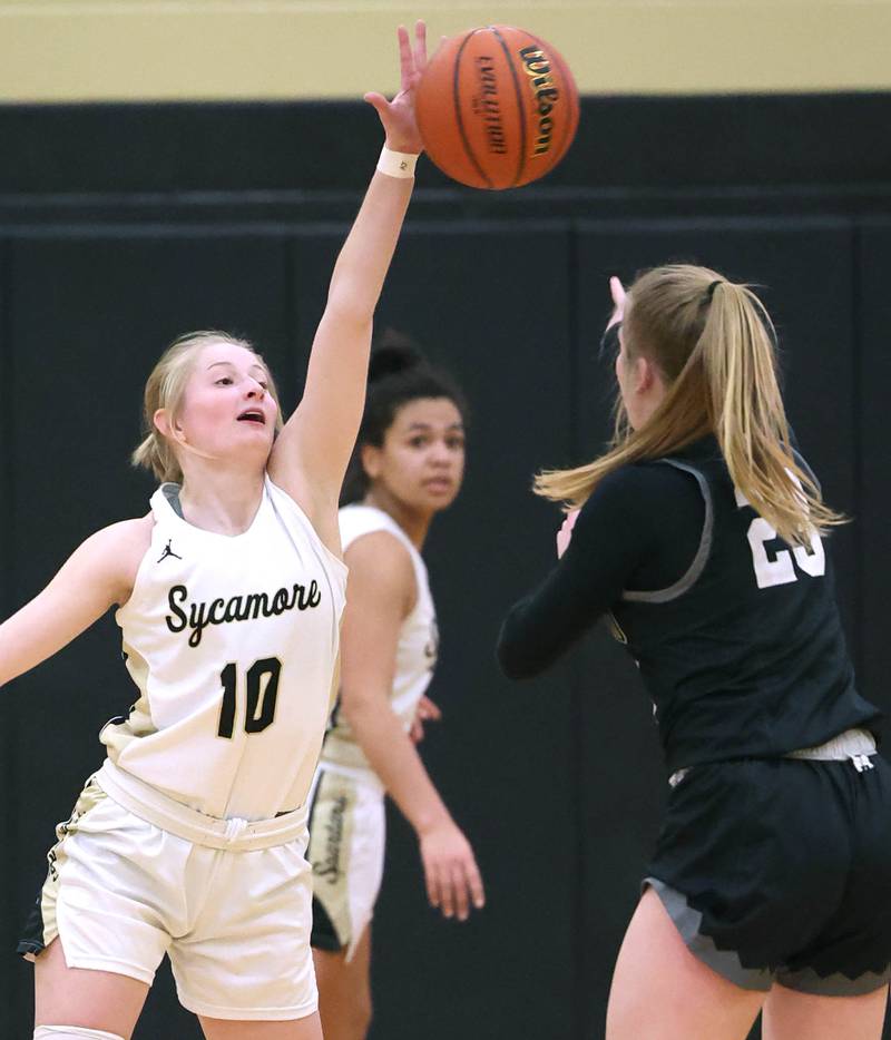Sycamore's Lexi Carlsen blocks a pass by Kaneland's Kendra Brown during the Class 3A regional final game Friday, Feb. 17, 2023, at Sycamore High School.