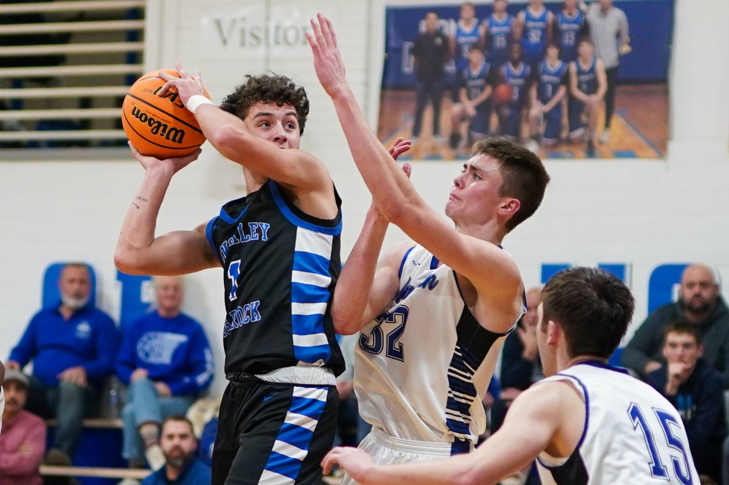 Hinckley-Big Rock's Sawyer Smith (1) plays the ball in the post against Newark’s Cody Kulbartz (32) during a basketball game at Newark High School on Tuesday, January 28, 2025.
