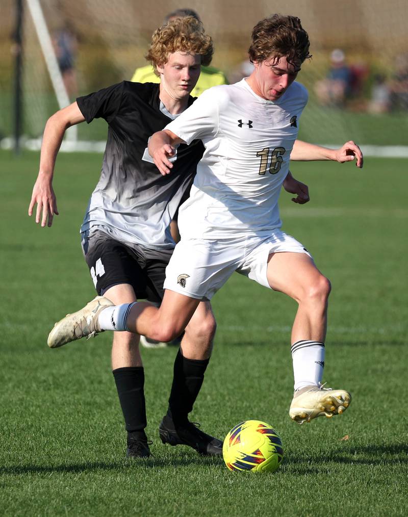Sycamore's Maddux McLaughlin (right) pushes the ball ahead of Kaneland's Tyler Adams during their game Wednesday, Sept. 16, 2025, at Kaneland High School in Maple Park.