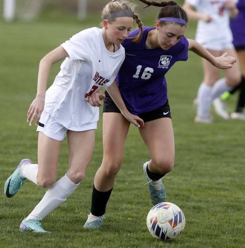 Huntley's Bella Fusco battles with Hampshire's Shayne Norris to get to the ball during a Fox Valley Conference soccer game on Tuesday, April 23, 2024, at Hampshire High School.