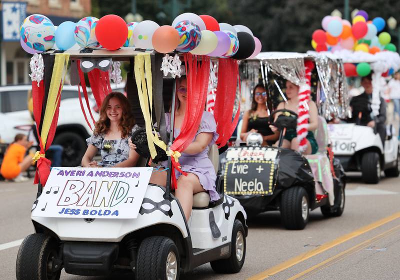 Some of the Sycamore High School club decorated golf carts make their way down State Street Wednesday, Sept. 20, 2023, during the Sycamore High School homecoming parade.