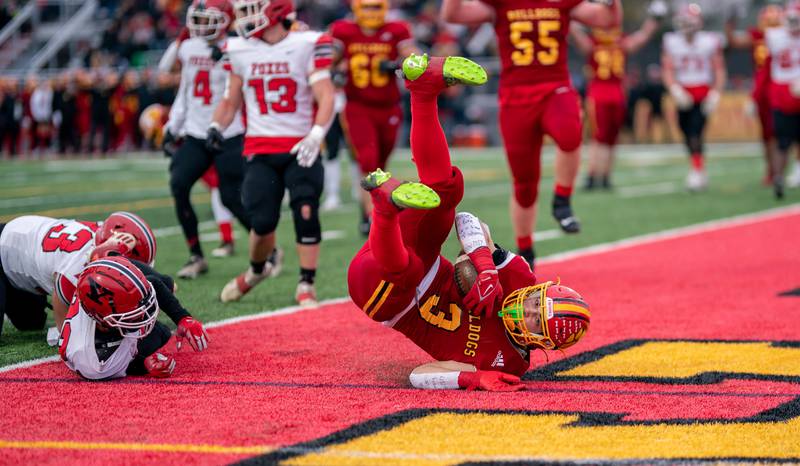 Batavia's Ryan Whitwell (3) dives into the end zone for a touchdown against Yorkville during a 7A quarterfinal playoff football game at Batavia High School on Saturday, Nov 12, 2022.