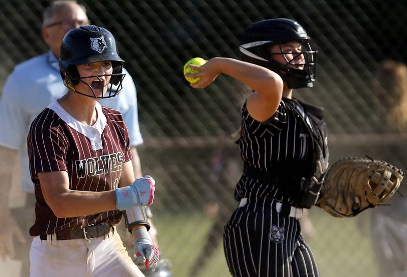 Prairie Ridge's Kylie Carroll celebrates scoring a run during a Fox Valley Conference softball game against Crystal Lake Central on Wednesday, May 14, 2025, at Crystal Lake Central High School.