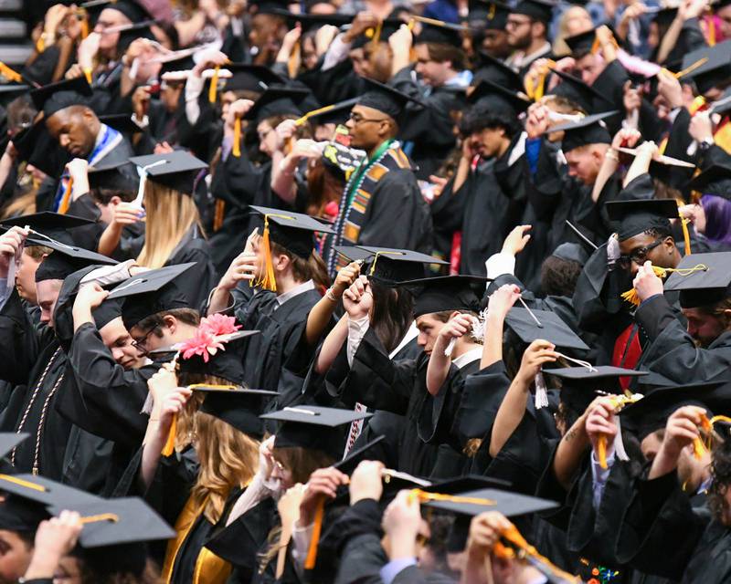 Graduates move their tassels over signifying they have met the requirements to graduate from Northern Illinois University on Saturday May 9, 2026, during the graduation commencement ceremony held at the Convocation Center in DeKalb.