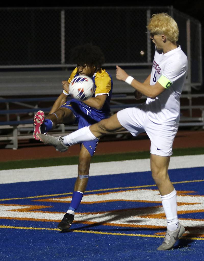 Prairie Ridge's Henry Knoll kicks the ball away from Chicago De La Salle's Christian Edwards during an IHSA Class 2A state semifinal soccer match on Friday, Nov. 8, 2024, at Hoffman Estates High School.